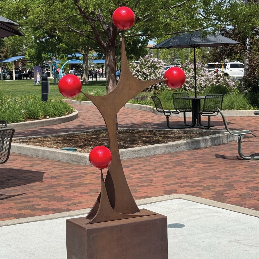 Abundance is a sculpture where form and red color combine to engage and delight viewers.