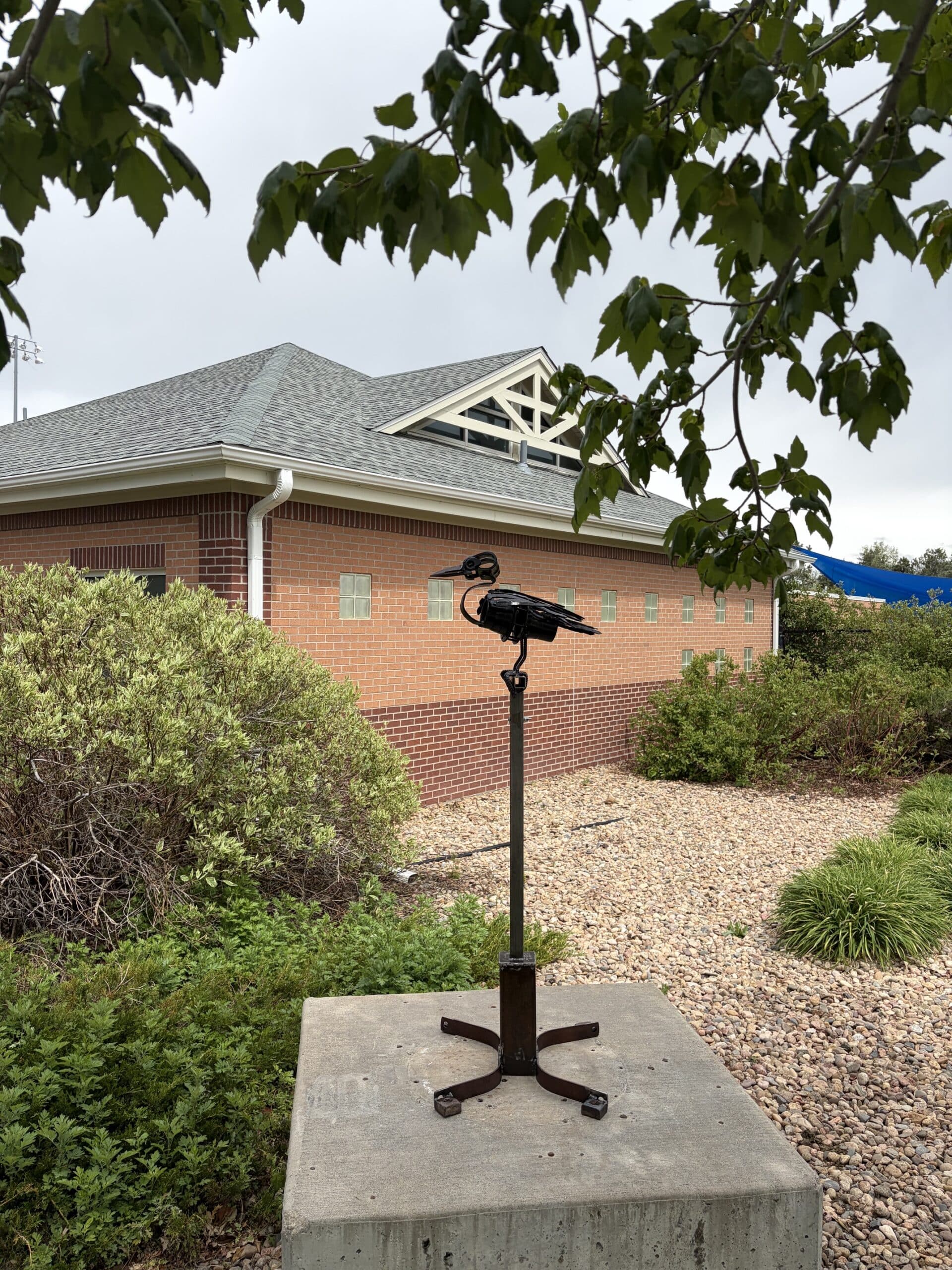 Caw is part of a "Bird on a Stick" series using repurposed metal and found objects.