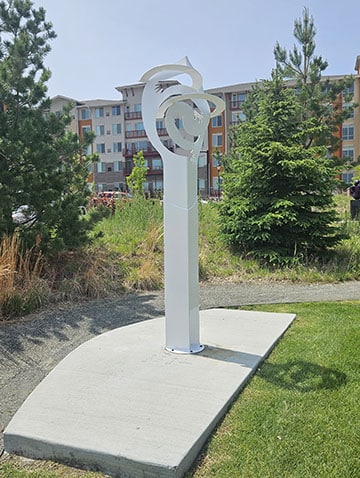 The Community Hug is a sculpture with circles of hands embracing as in a hug.