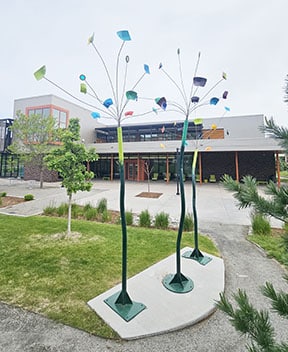 Dancing Aspens by artist Reven Swanson has three 14-foot tall forms with kinetic leaves of varying colors.
