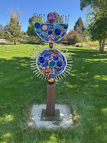 Dark Side of the Harlequin Moon is a bright colorful sculpture based on the artist's connection to nature.