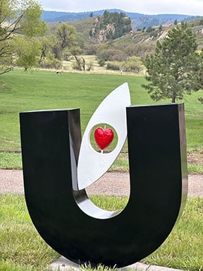 Eye Love U by Justin Deister is a large sculpture of the letter U, with an eye in the middle of the U.