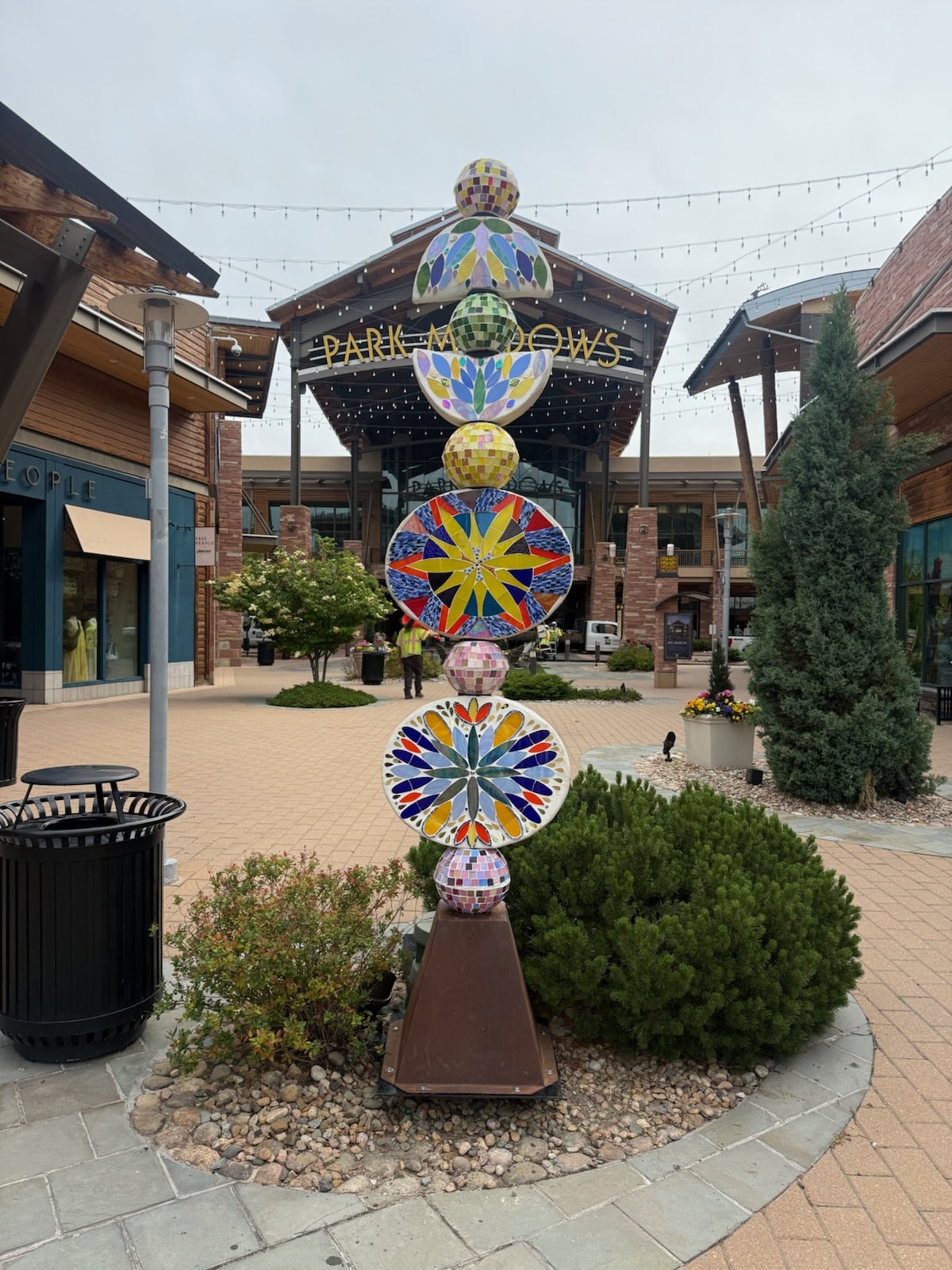 Flower Power, Side A & B, combines colorful stacked joyful blossoms stacked in a totem.