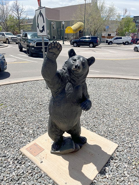 High Five is a sculpture of a bear giving a high five.
