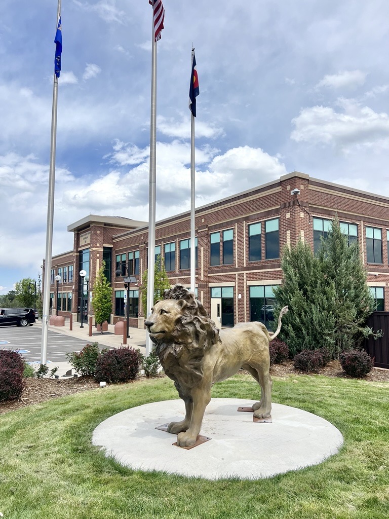 Strength and Courage is a bronze sculpture of a lion standing tall and proud.